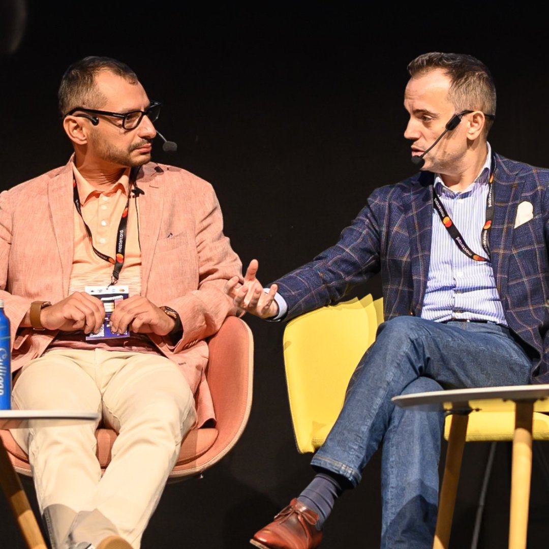 Medium shot photograph of people at a table with awards and items.