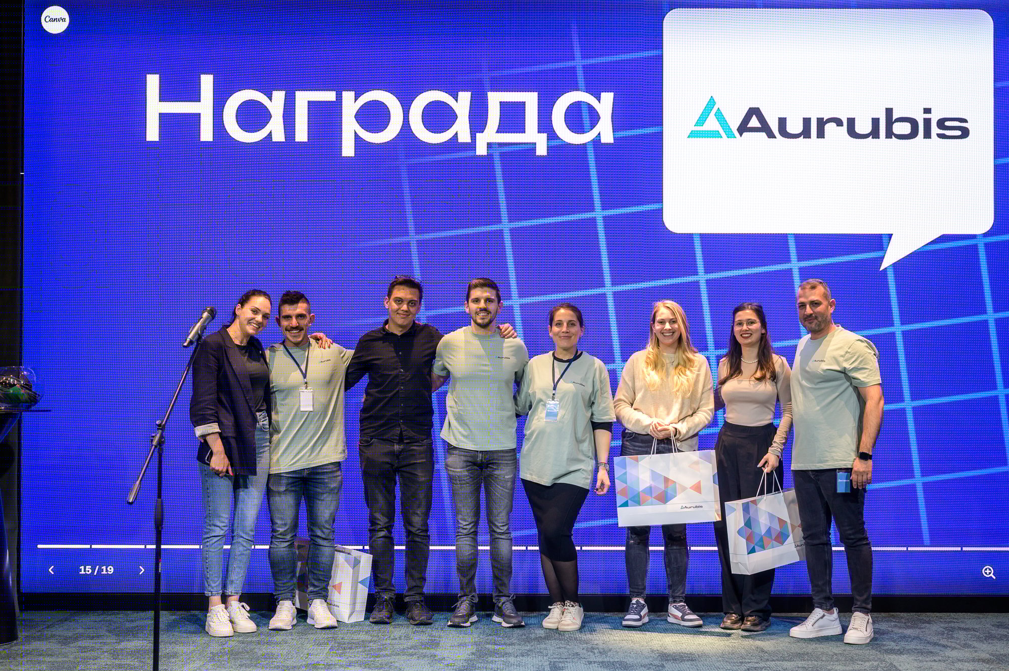 Black and white photograph of a group of people on a stage.