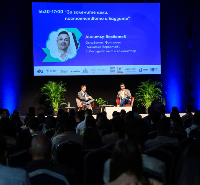 Photographic image of individuals interacting in a professional setting.