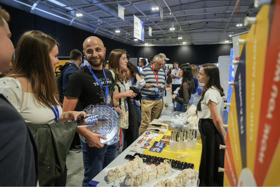Medium shot photograph of two individuals seated, engaged in a discussion.