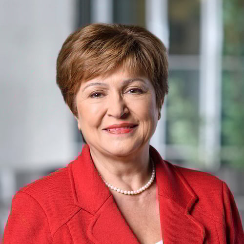 Portrait photograph of a woman with long hair, smiling.