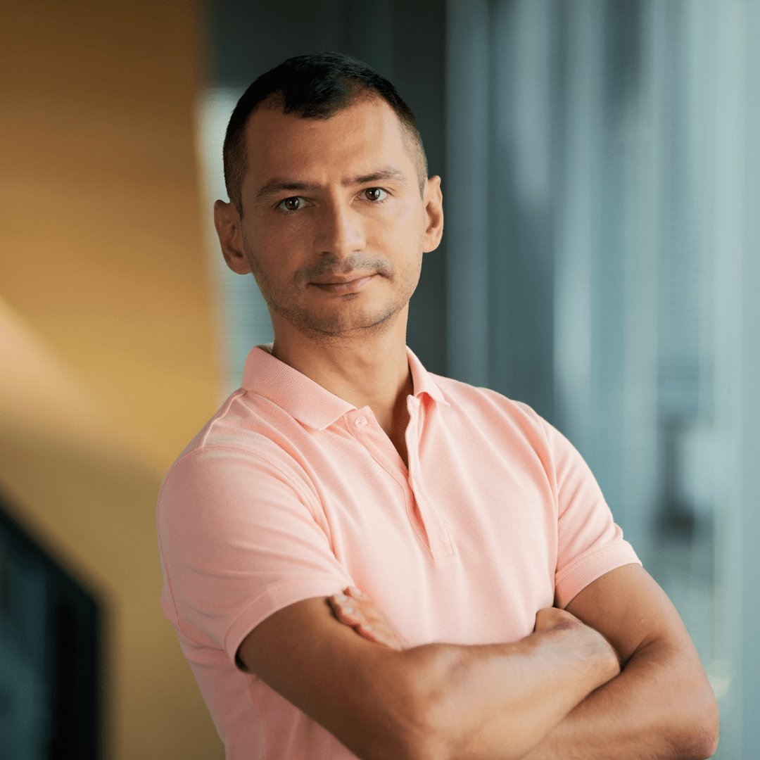 Portrait photograph of a woman with long hair, smiling.