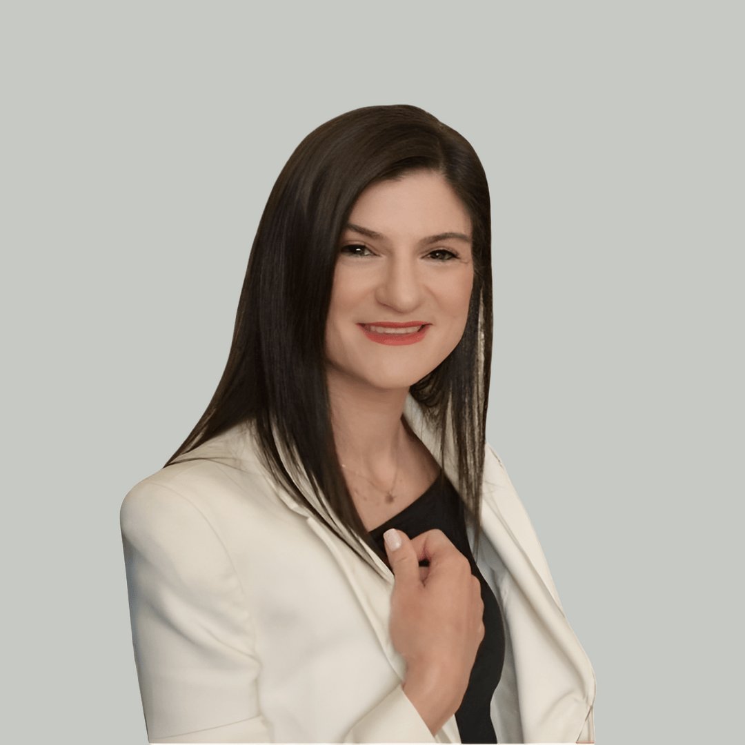 Portrait photograph of a woman with long hair, smiling.