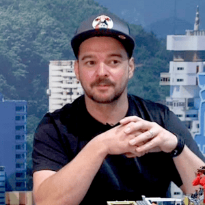 Portrait photograph of a woman with long hair, smiling.
